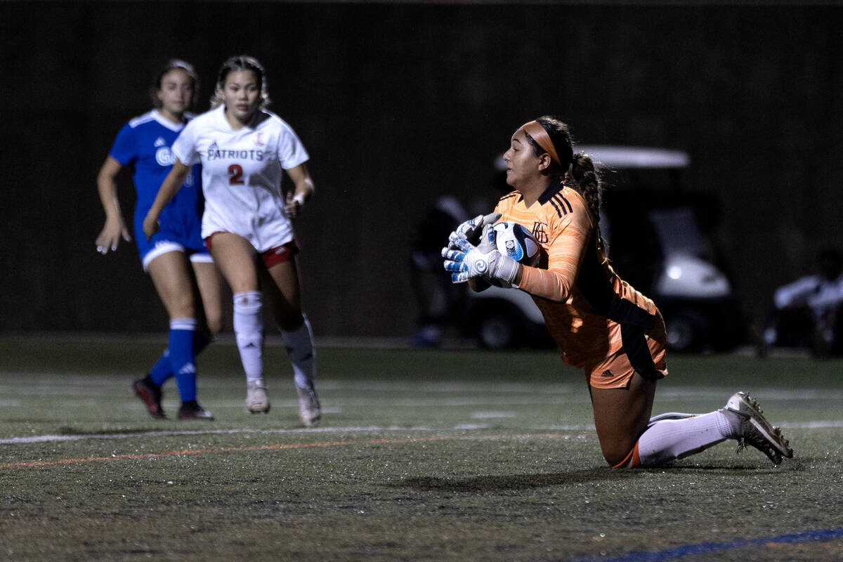 Bishop Gorman goalkeeper Laila Lazzara saves an attempted goal by Liberty midfielder Natalie Co ...