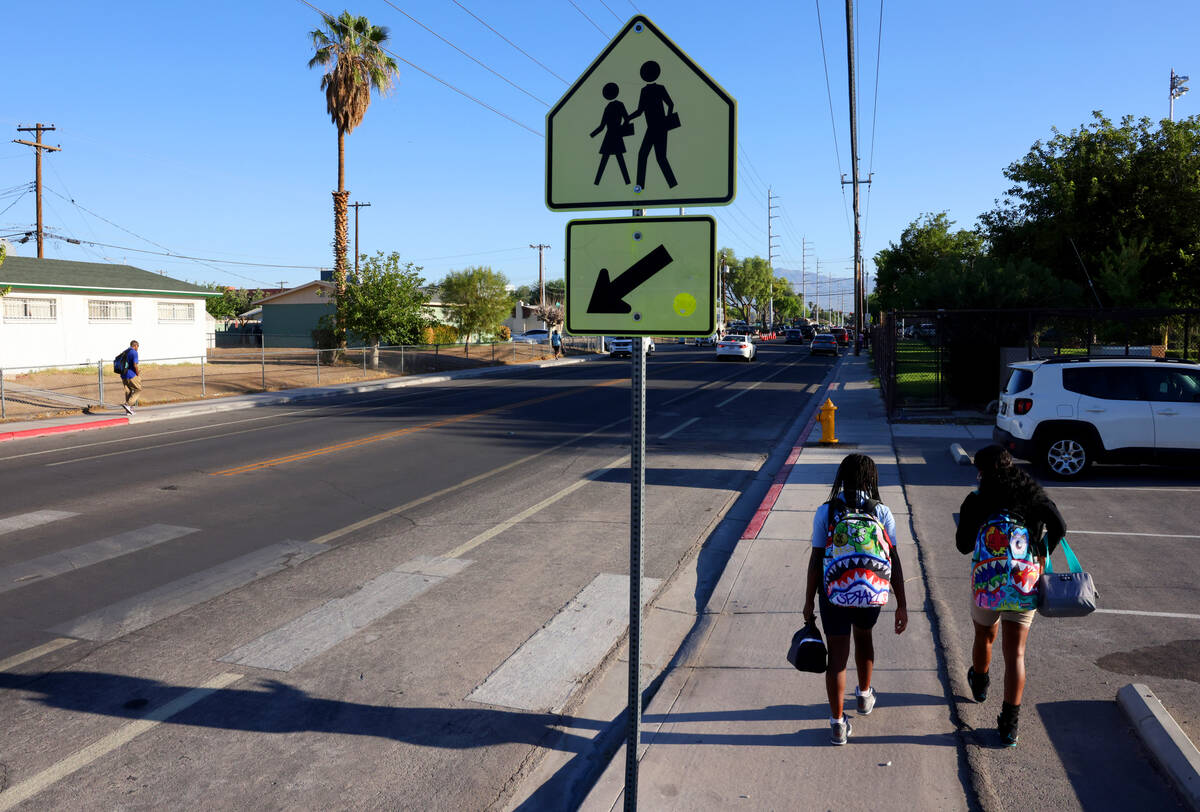 Students walk to Democracy Prep in Las Vegas on the first day of school Monday, Aug. 7, 2023. ( ...