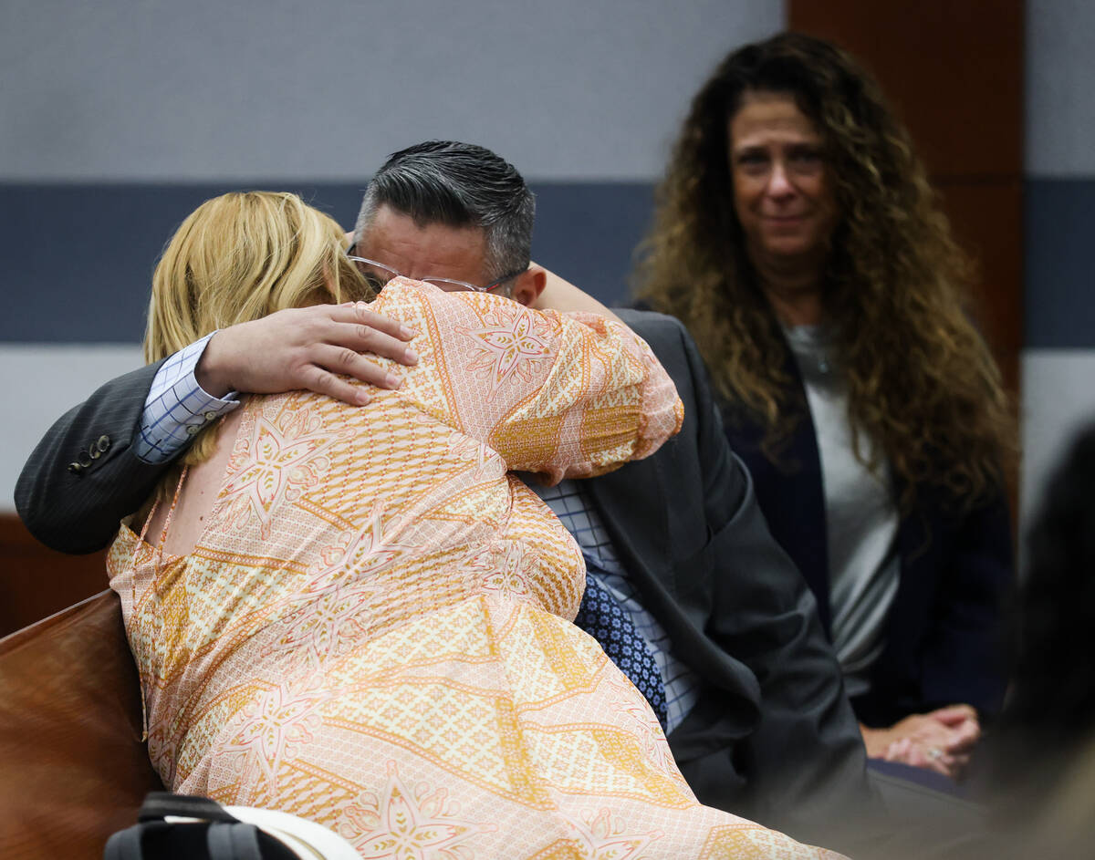 The parents of Aiden Cicchetti embrace each other after the charges against their son were dism ...