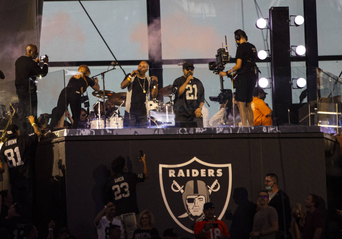 Too $hort, center left, and Ice Cube perform during halftime at an NFL game between the Raiders ...