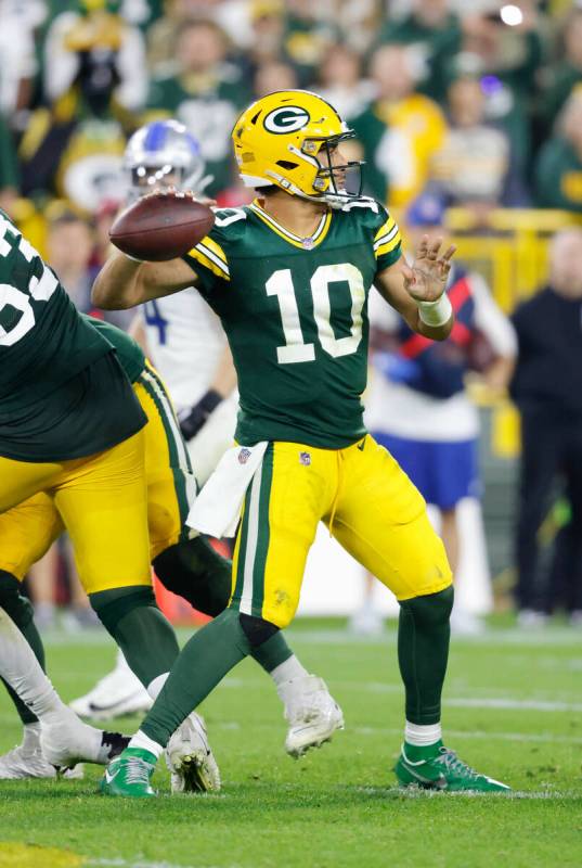 Green Bay Packers quarterback Jordan Love (10) looks to throw during a NFL football game agains ...