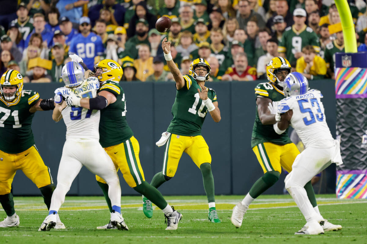 Green Bay Packers quarterback Jordan Love (10) passes during an NFL football game between the G ...