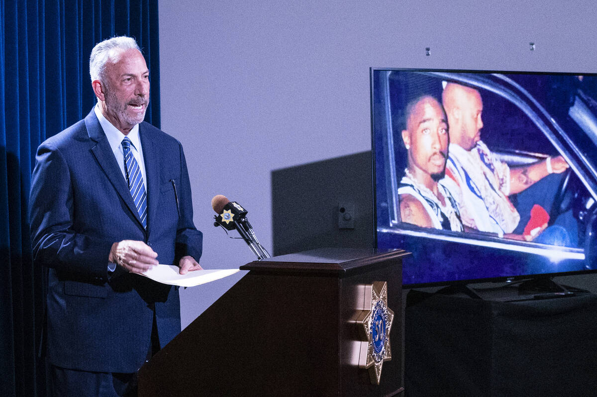 A photograph of rapper Tupac Shakur, right, is displayed as Clark County District Attorney Stev ...