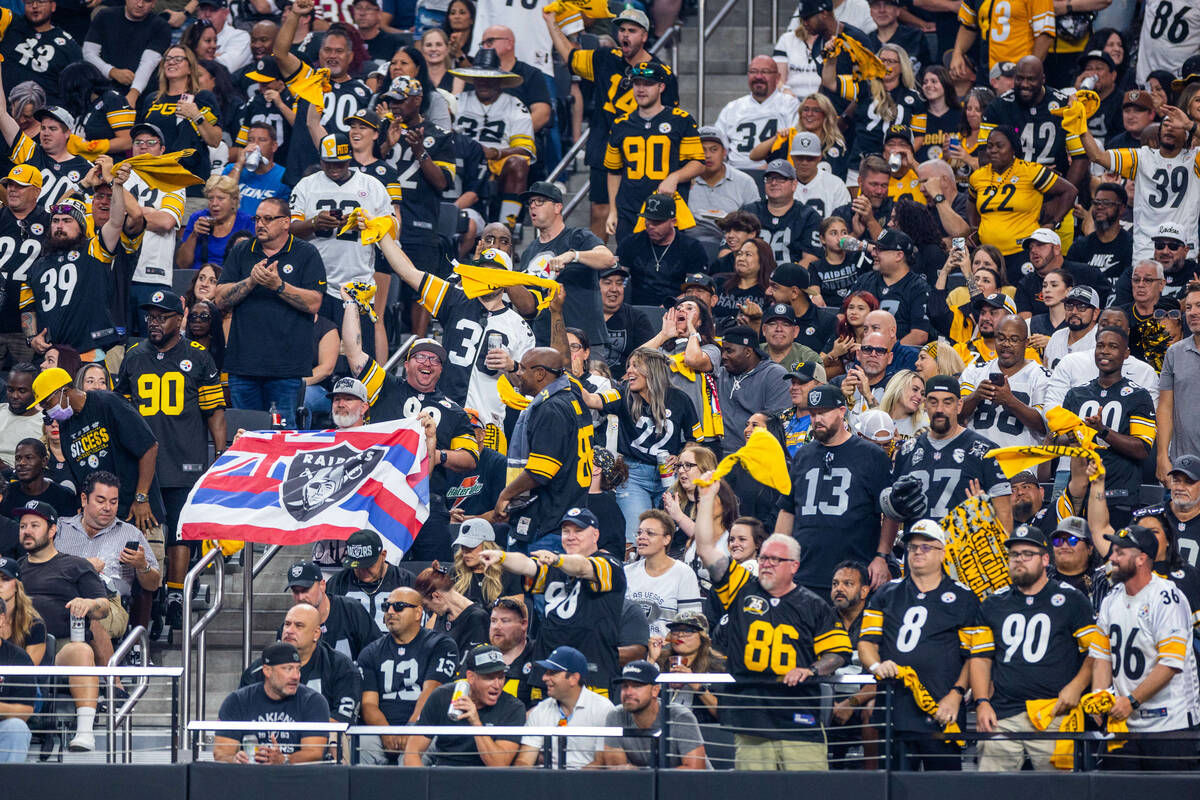 Pittsburgh Steelers fans wave their terrible towels as they dominate the Raiders during the fir ...