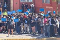 Students walk out of Las Vegas Academy of the Arts on Friday, Oct. 6, 2023, calling for teacher ...