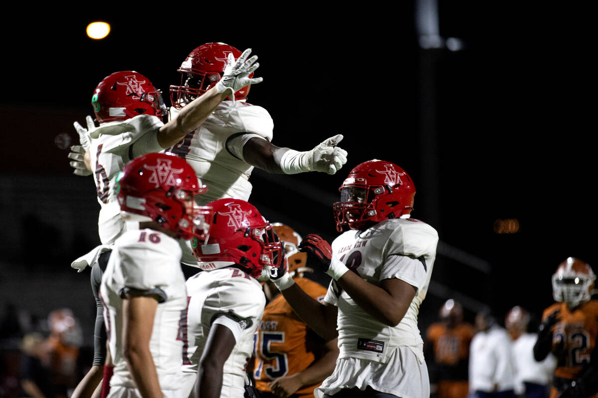Arbor View wide receiver Jayden Williams (6) chest bumps guard Daniel Boyd after Williams score ...