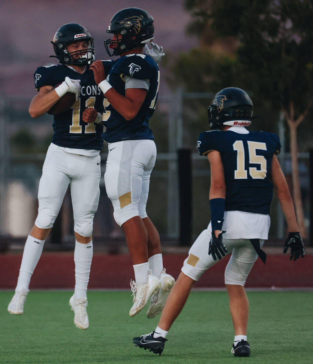 Foothill wide receiver Devon Wake (12) celebrates a touchdown with his teammates during a game ...