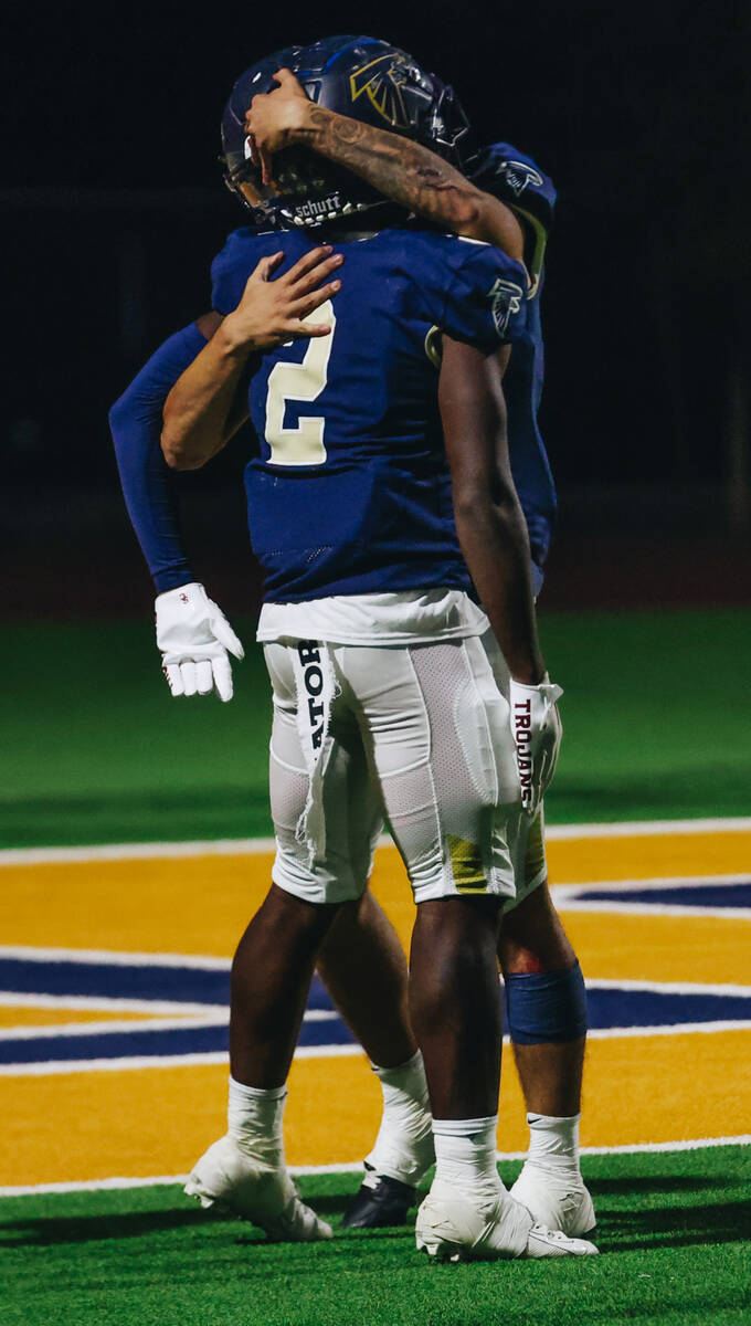 Foothill wide receiver Tarrell Mack-Lovely (2) celebrates a touchdown with a teammate during a ...