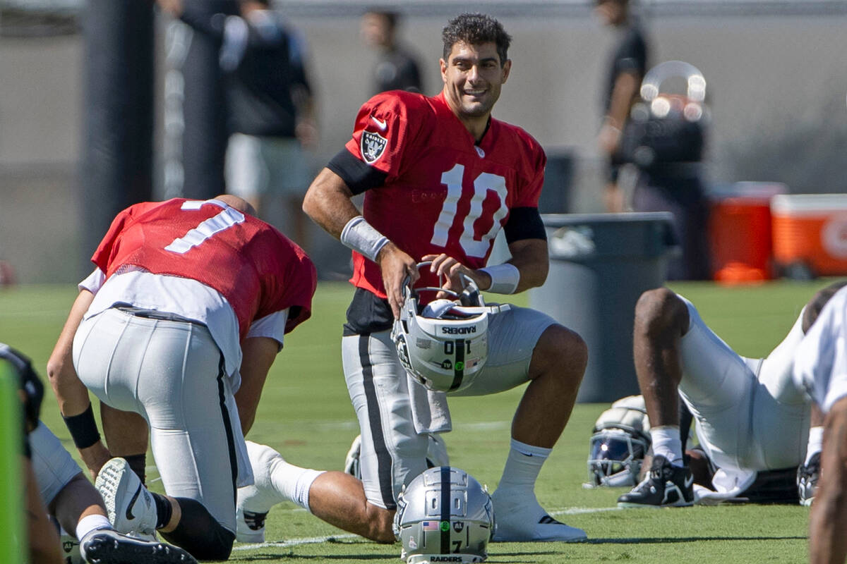Raiders quarterback Jimmy Garoppolo (10) smiles during the team’s practice at the Interm ...
