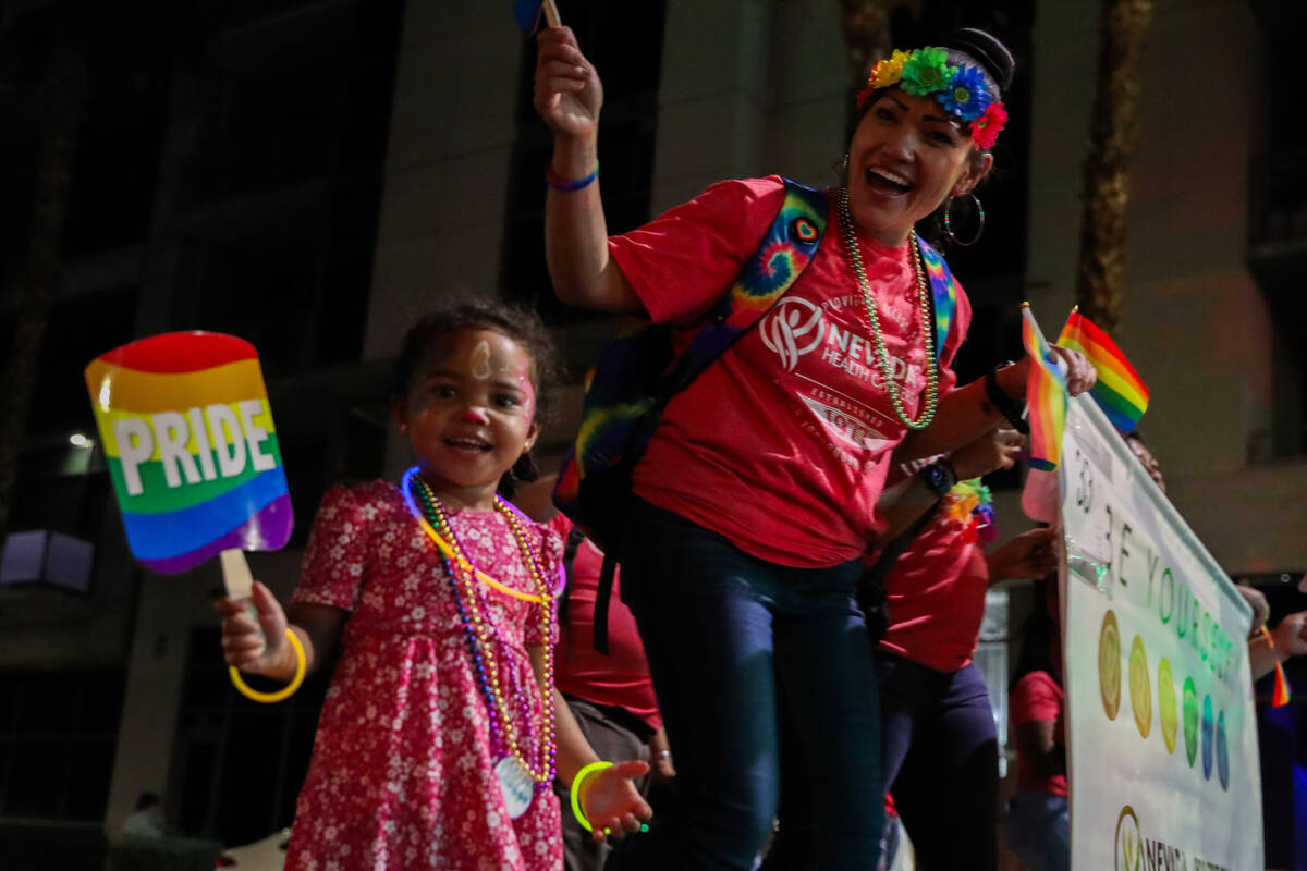 A group of people with Nevada Health Centers at the Annual Las Vegas PRIDE Night Parade on Frid ...