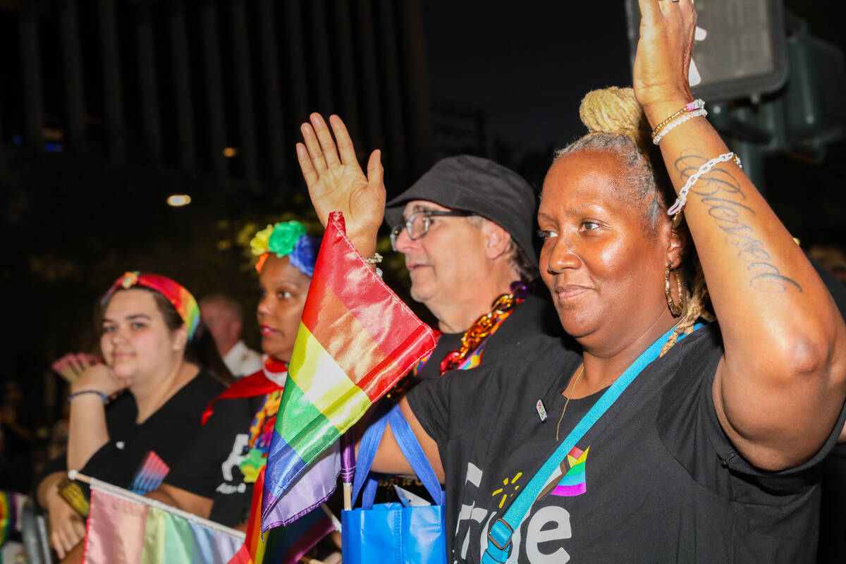 Angela Silver, right, and others cheer on the Annual Las Vegas PRIDE Night Parade on Friday, Oc ...