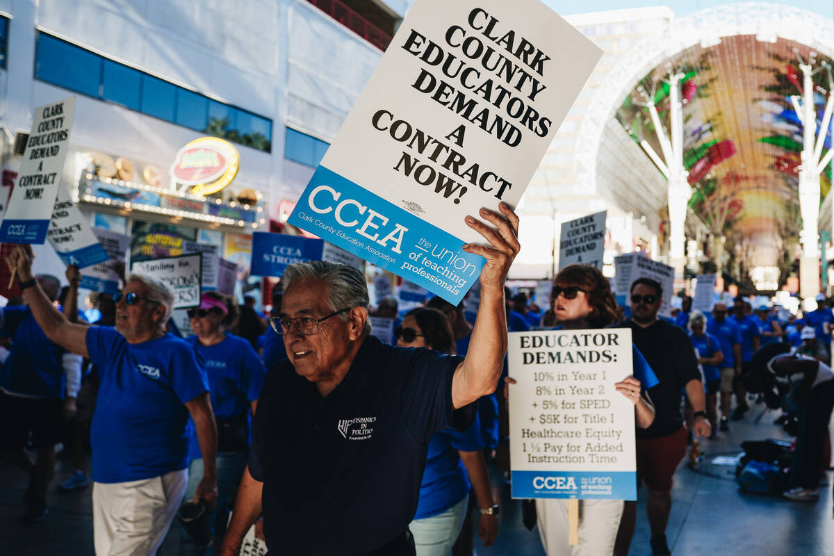Demonstrators march in support of the Clark County Education Association at the Fremont Street ...