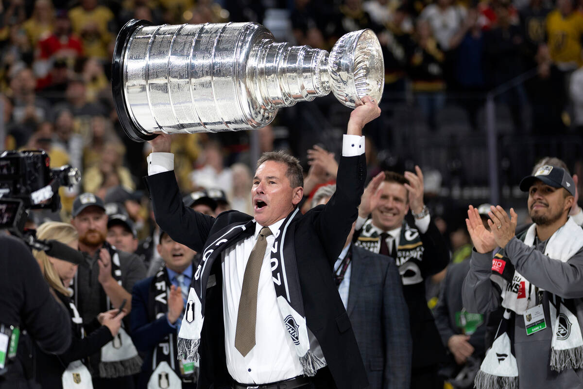 Golden Knights head coach Bruce Cassidy holds up his team’s Stanley Cup after they beat ...