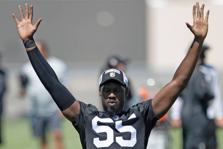 Raiders defensive end Chandler Jones (55) stretches during an organized team activity at Interm ...