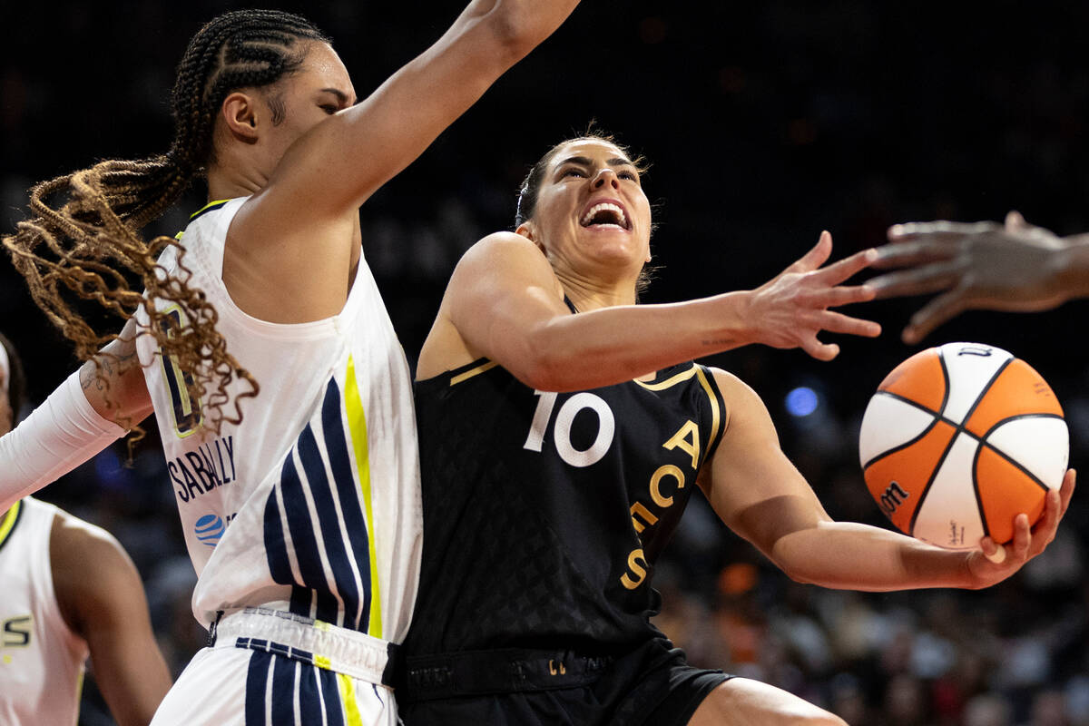 Las Vegas Aces guard Kelsey Plum (10) shoots against Dallas Wings forward Satou Sabally during ...