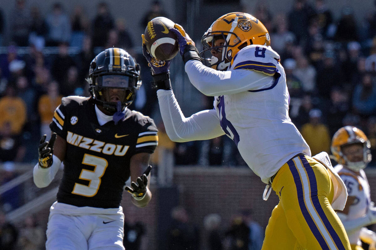 LSU safety Major Burns (8) intercepts a pass intended for Missouri wide receiver Luther Burden ...