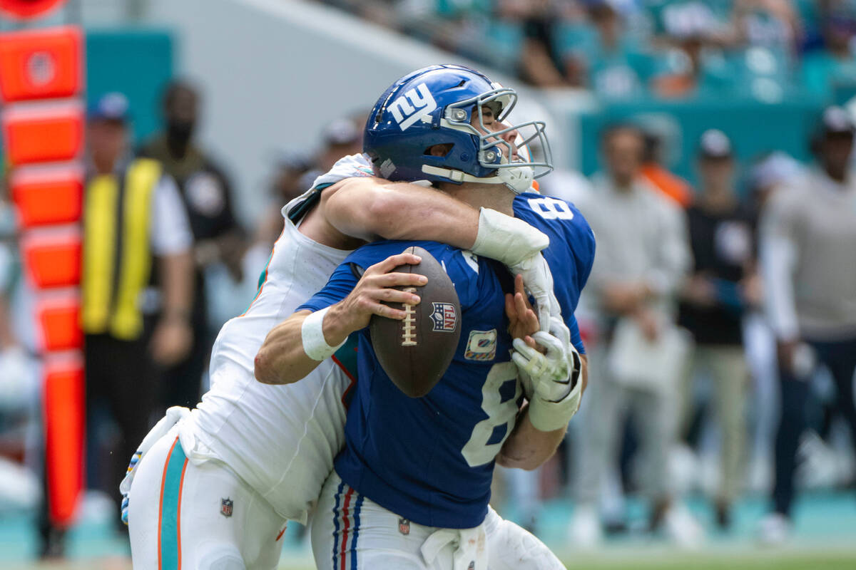 Miami Dolphins linebacker Andrew Van Ginkel (43) sacks New York Giants quarterback Daniel Jones ...