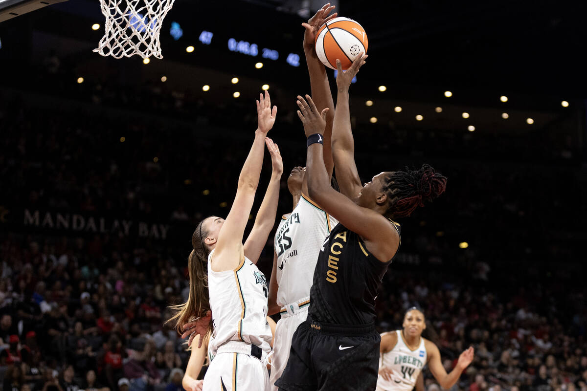 Las Vegas Aces guard Chelsea Gray (12) shoots against New York Liberty guard Sabrina Ionescu (2 ...