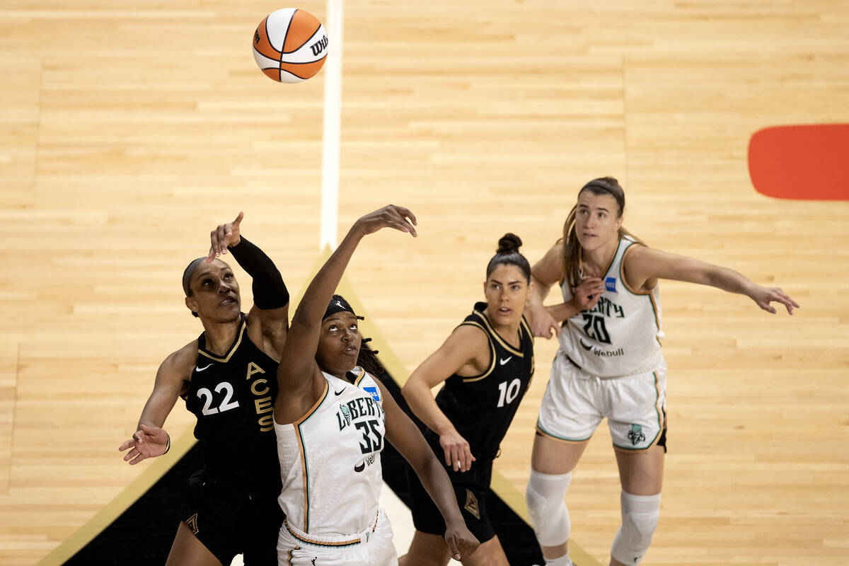 Las Vegas Aces forward A'ja Wilson (22) and New York Liberty forward Jonquel Jones (35) tip off ...
