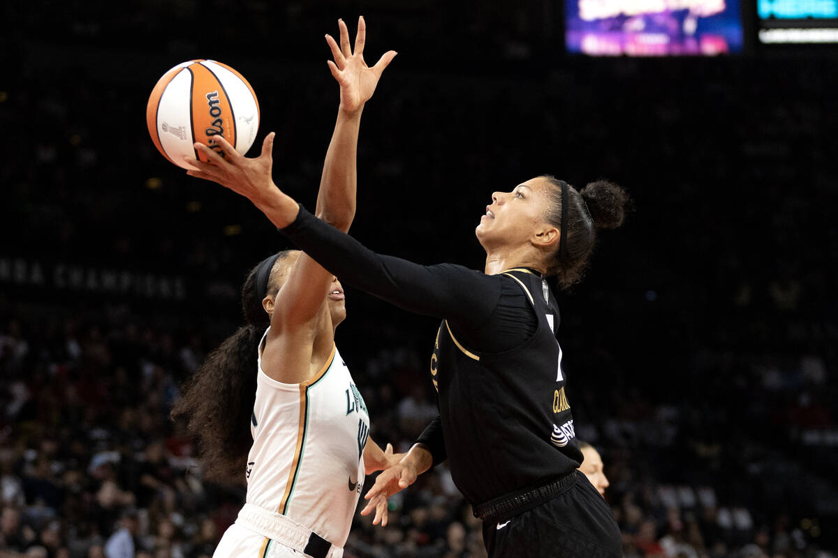 Las Vegas Aces forward Alysha Clark (7) shoots against New York Liberty forward Betnijah Laney ...