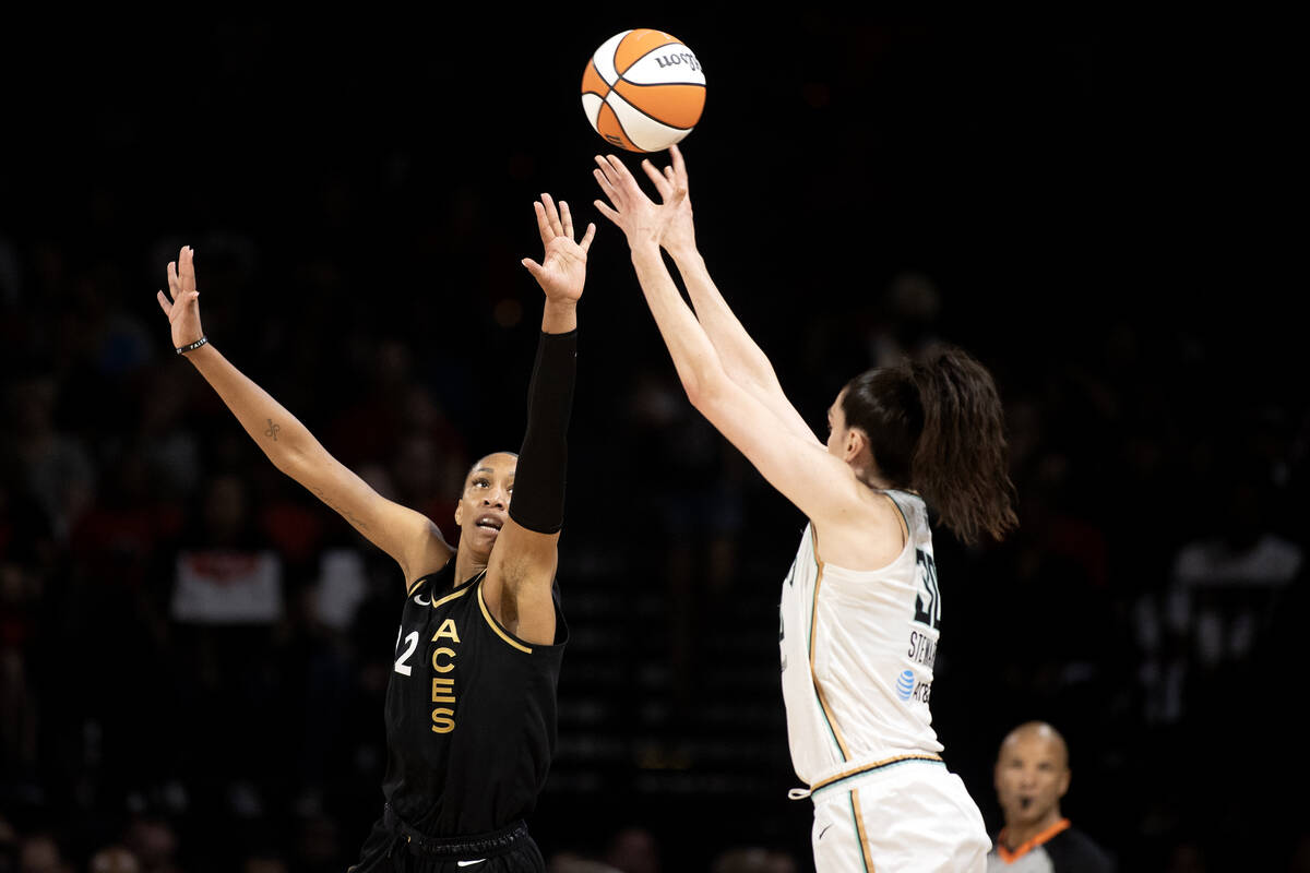 Las Vegas Aces forward A'ja Wilson (22) defends while New York Liberty forward Breanna Stewart ...