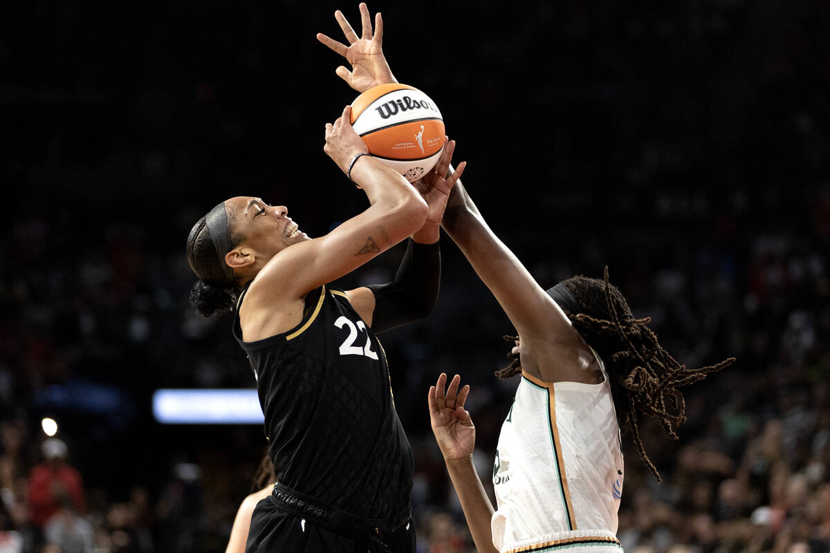 Las Vegas Aces forward A'ja Wilson (22) is fouled by New York Liberty forward Jonquel Jones (35 ...