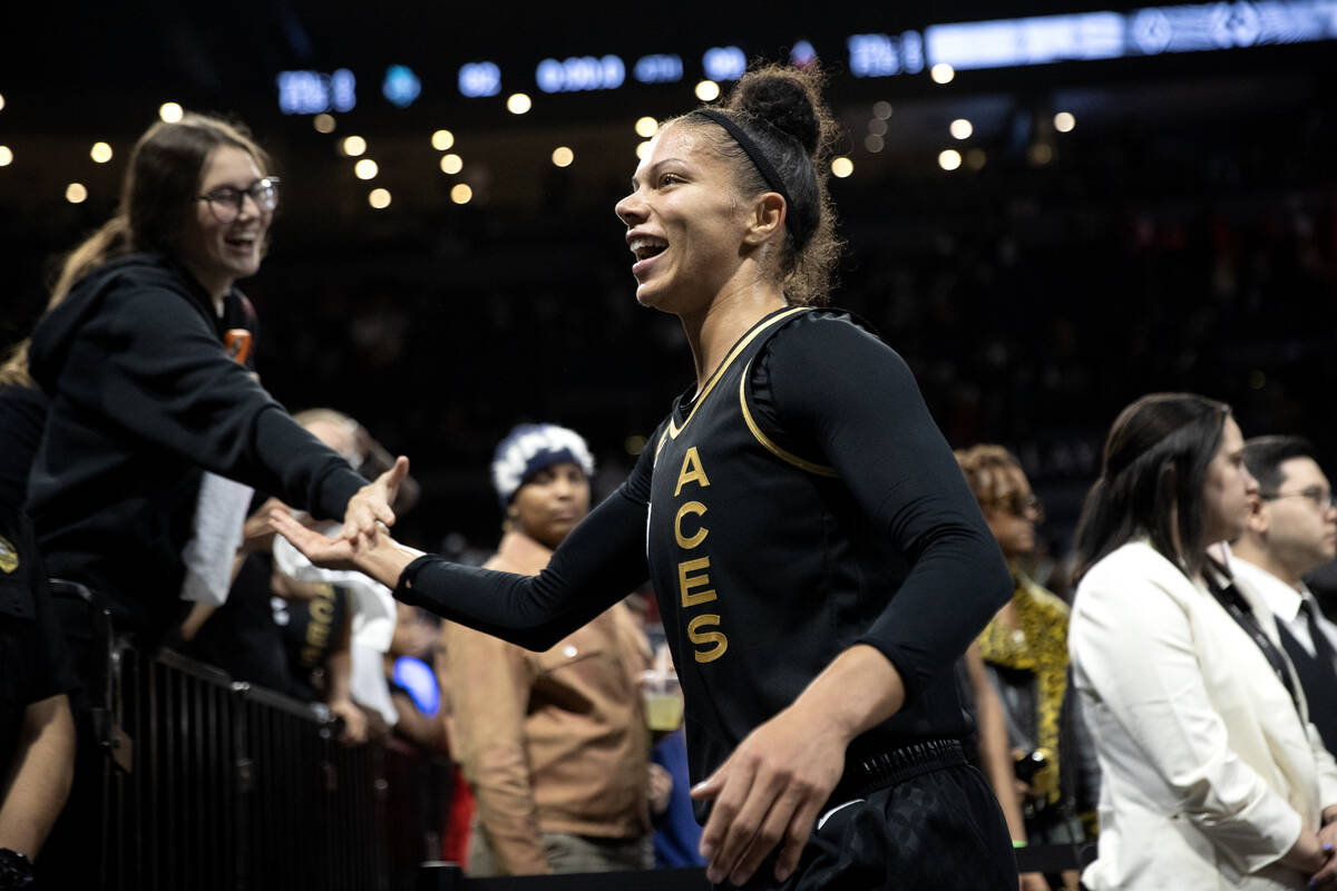 Las Vegas Aces forward Alysha Clark (7) slaps hands iwht a fan after winning Game 1 of a WNBA b ...