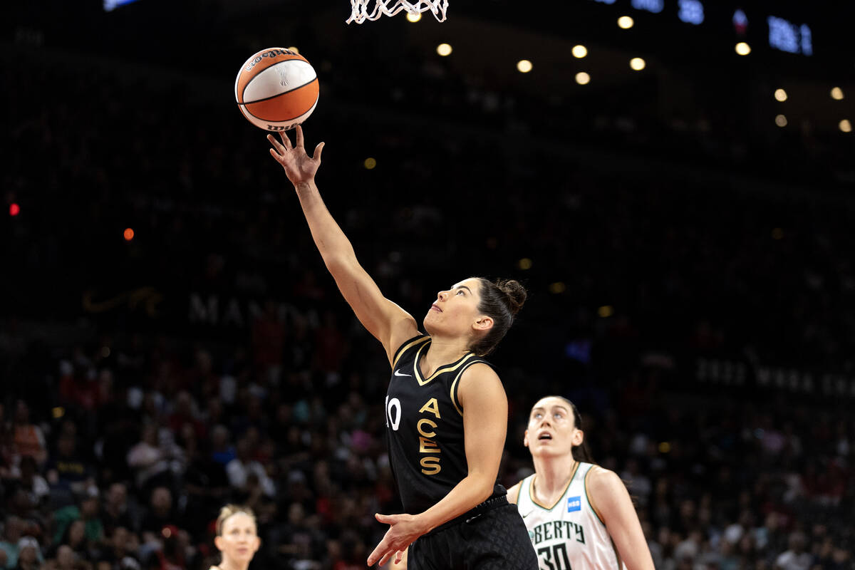 Las Vegas Aces guard Kelsey Plum (10) shoots while New York Liberty forward Breanna Stewart (30 ...