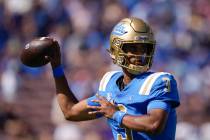UCLA quarterback Dante Moore throws during the first half of an NCAA college football game agai ...