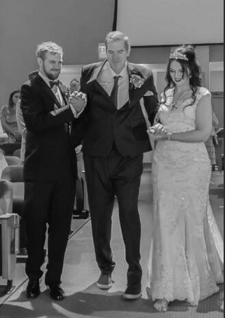 Scott Frost walking his daughter down the aisle. (Courtesy)