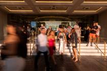 Guests to the Las Vegas Strip enter and exit Caesars Palace on Friday, Sept. 15, 2023, in Las V ...