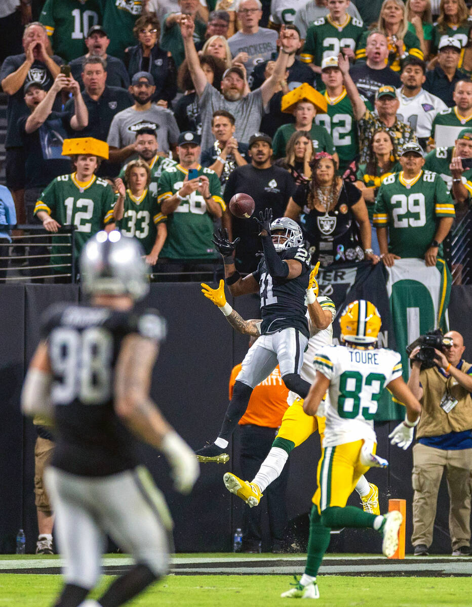 Raiders cornerback Amik Robertson (21) intercepts a pass in the end zone intended for Green Bay ...