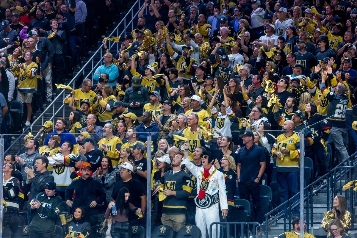 Golden Knights fans celebrate the first goal of the season against the Seattle Kraken during th ...