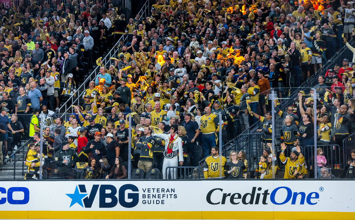 Golden Knights fans celebrate the second goal of the season against the Seattle Kraken during t ...