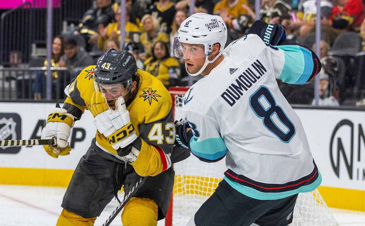 Golden Knights center Paul Cotter (43) grabs his face after a high stick by Seattle Kraken defe ...