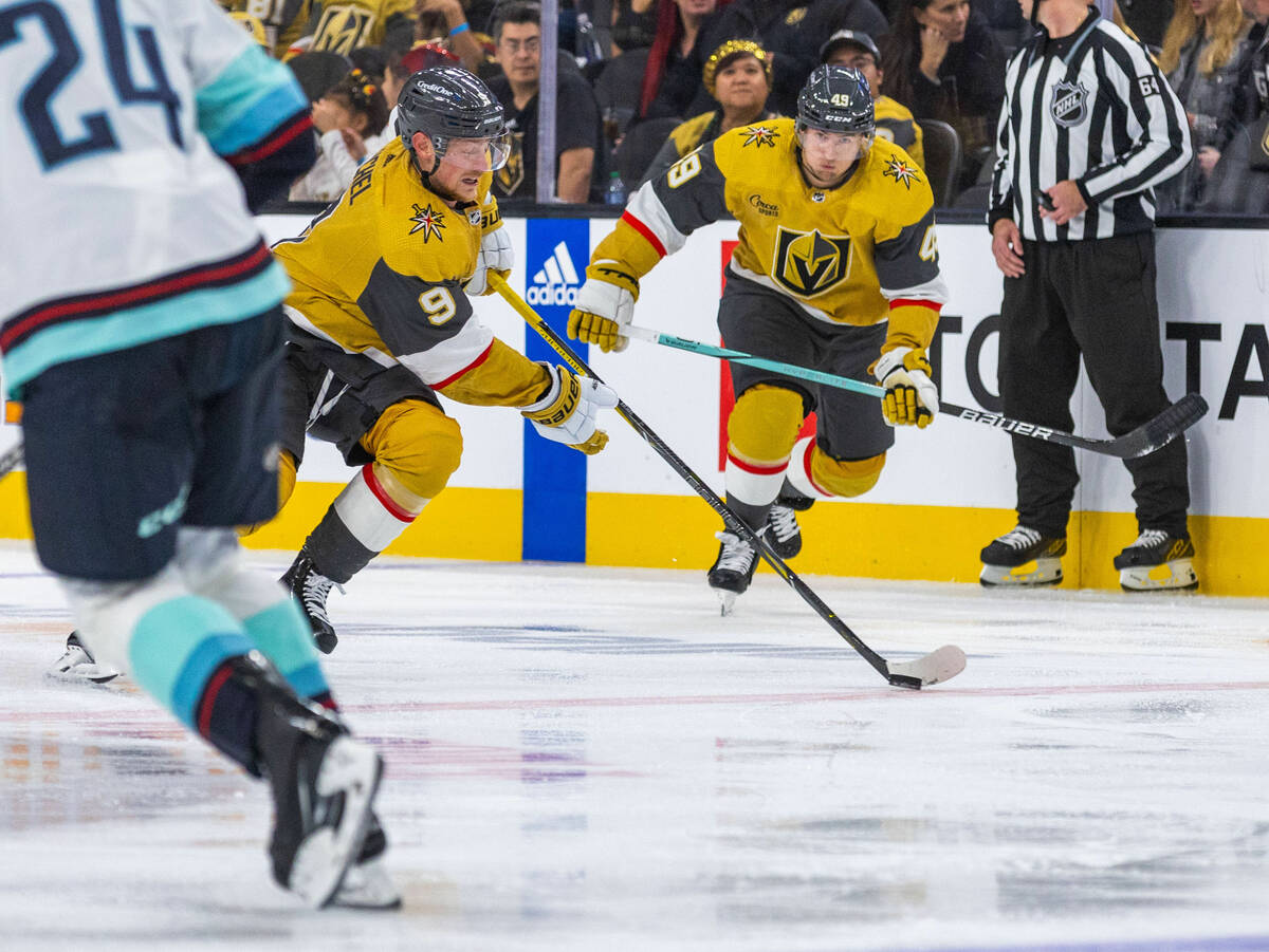 Golden Knights center Jack Eichel (9) breaks for the net as center Ivan Barbashev (49) trails a ...