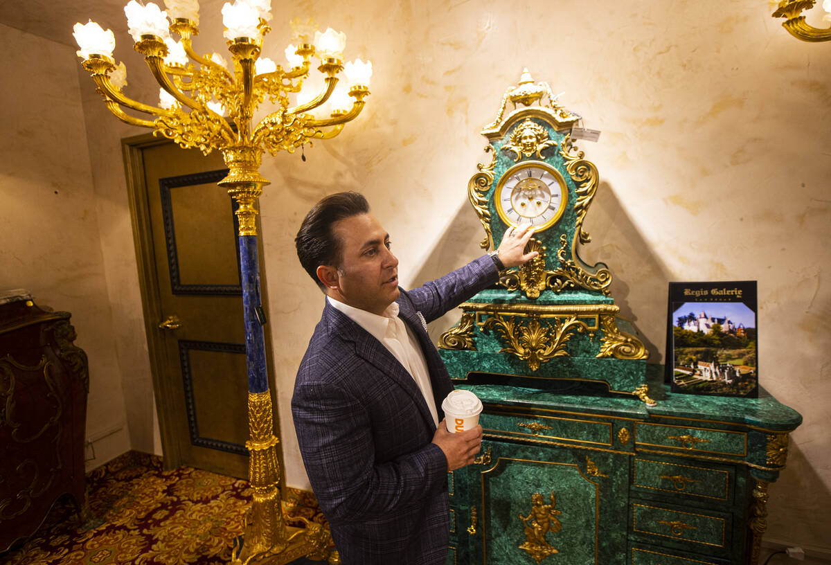 Ike Dweck, vice president of Regis Galerie, points to a 20th century Tiffany & Co. clock ma ...