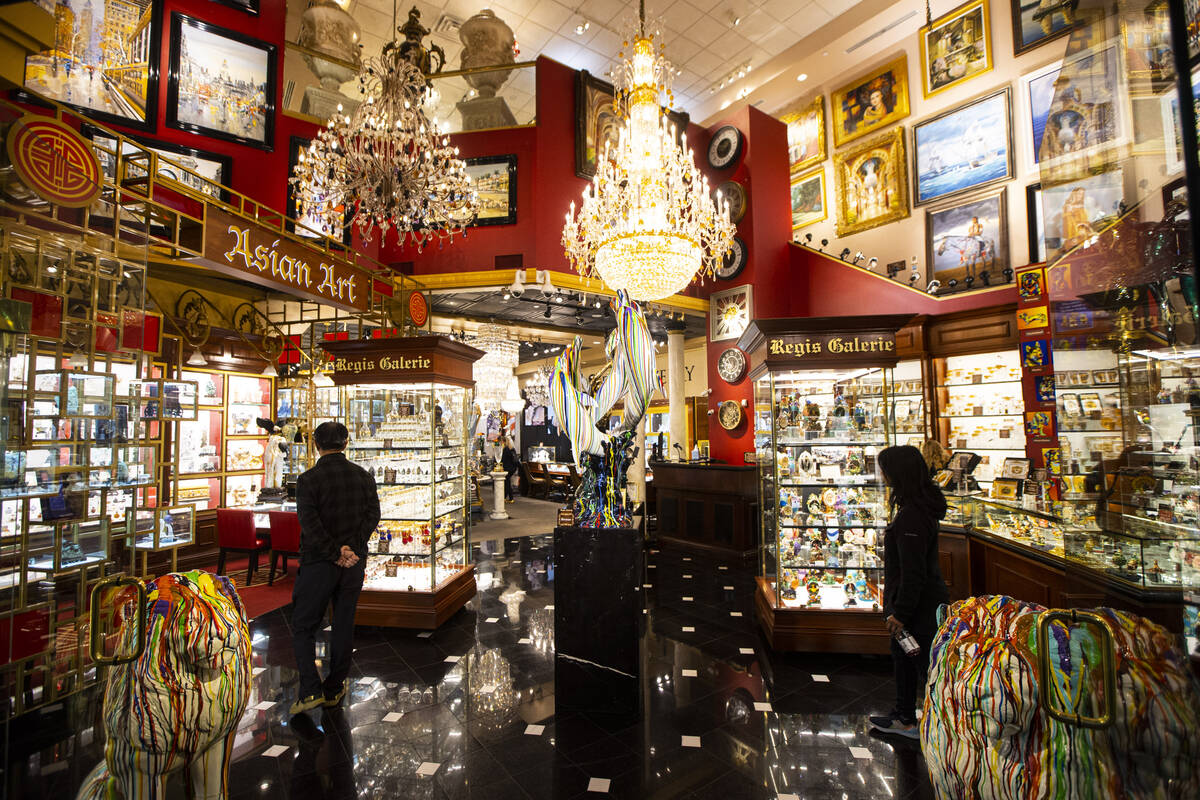 People browse through items at Regis Galerie in the Grand Canal Shoppes at The Venetian on Wedn ...