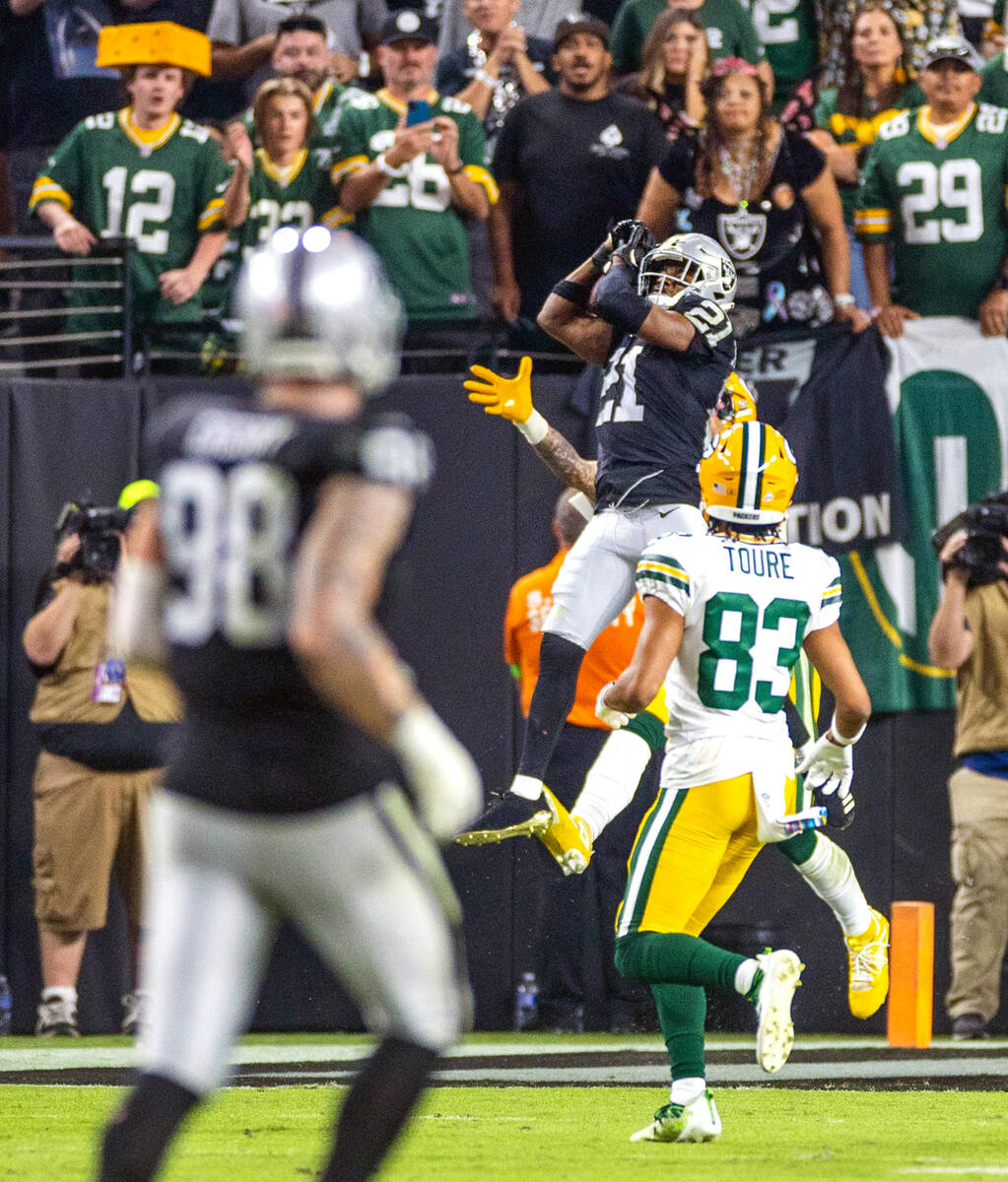 Raiders cornerback Amik Robertson (21) intercepts a pass in the end zone intended for Green Bay ...