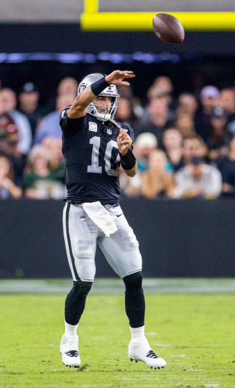 Raiders quarterback Jimmy Garoppolo (10) gets off a pass against the Green Bay Packers during t ...