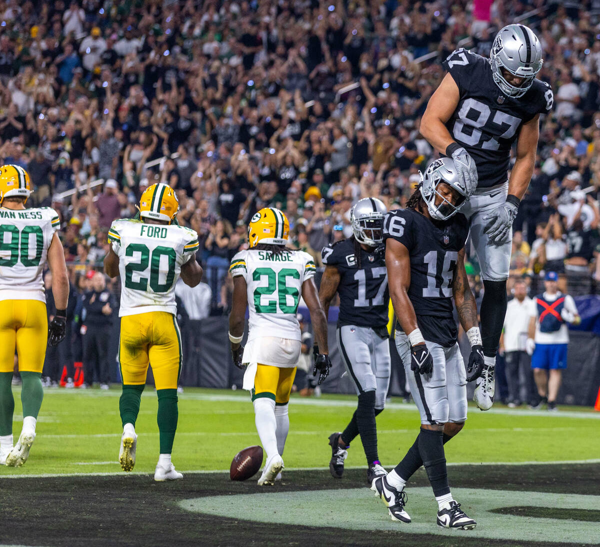 Raiders wide receiver Jakobi Meyers (16) is celebrated on a touchdown by tight end Michael Maye ...