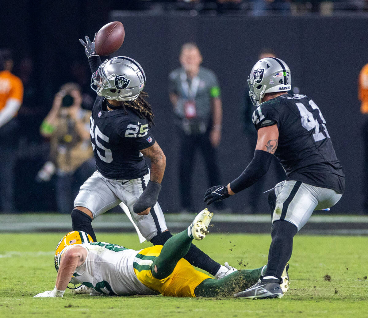 Raiders safety Tre'von Moehrig (25) attempts an interception against the Green Bay Packers duri ...