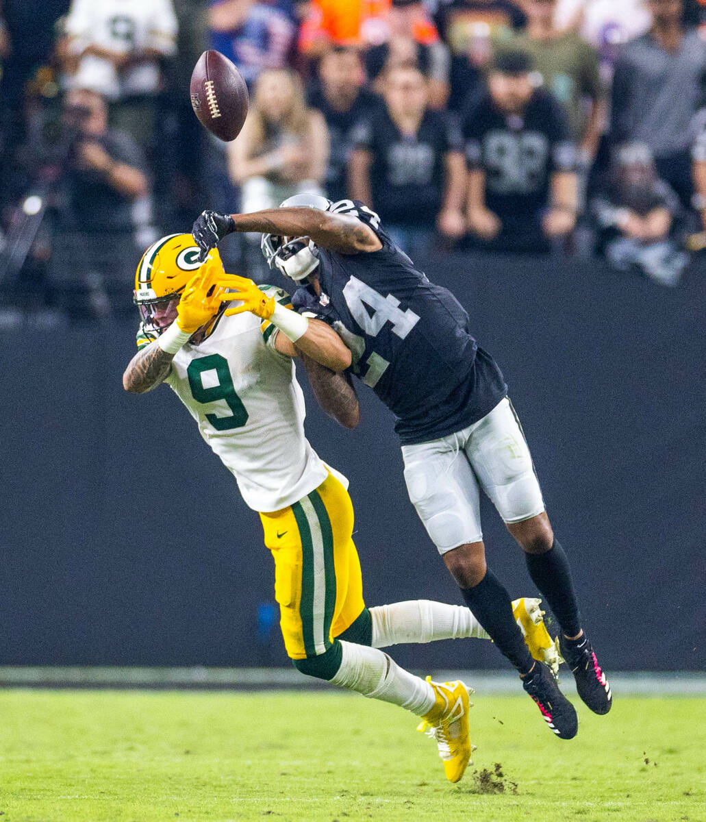 Green Bay Packers wide receiver Christian Watson (9) has a pass deflected away by Raiders corne ...
