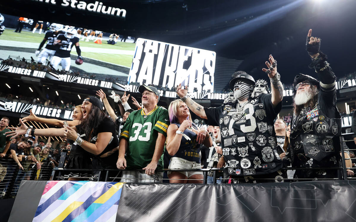 Raiders fans celebrate a 17-13 win against the Green Bay Packers following the second half of t ...