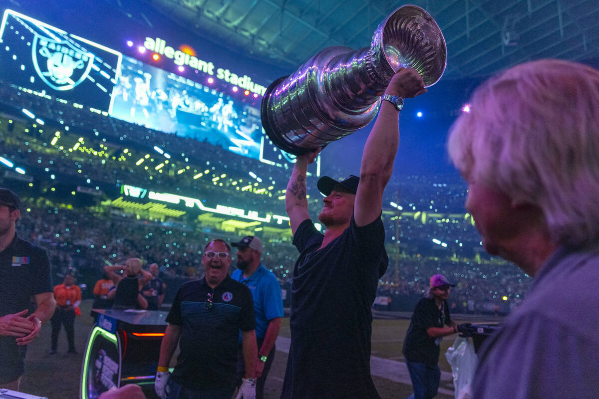 Golden Knights’ Jack Eichel hoists up the Stanley Cup following an interview on Monday N ...