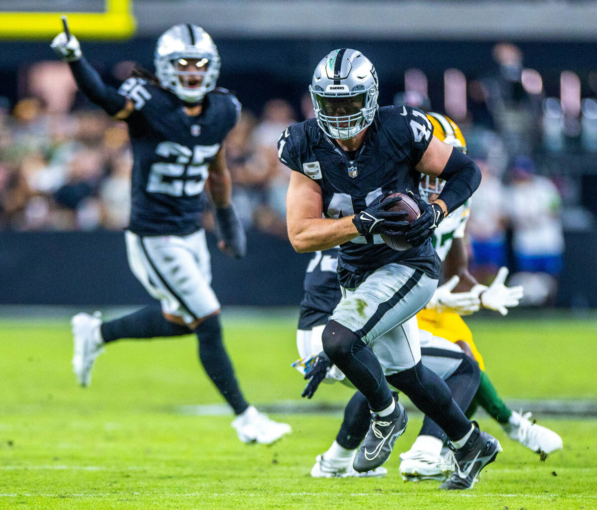 Raiders linebacker Robert Spillane (41) intercepts a pass from Green Bay Packers quarterback Jo ...