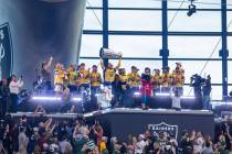 The Golden Knights with the Stanley Cup in the air for the torch lighting as the Raiders face t ...