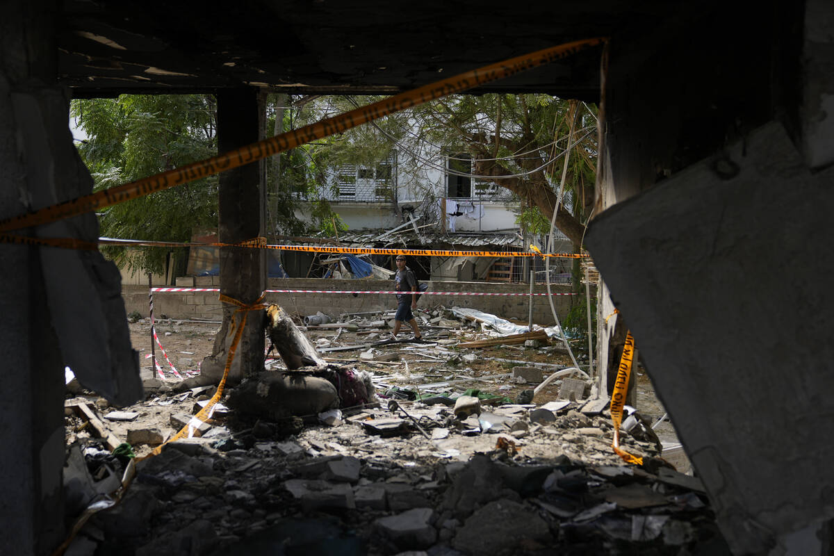 Destruction made by a rocket fired from the Gaza Strip is seen in Ashkelon, Israel, Monday, Oct ...