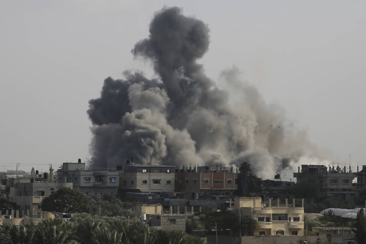 Smoke rises from an explosion caused by Israeli airstrikes on the border between Egypt and Rafa ...
