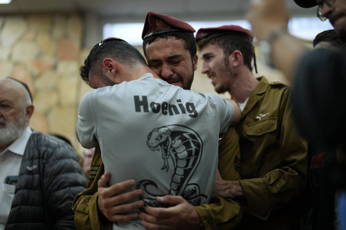 Mourners react during the funeral of Israeli soldier Benjamin Loeb, a dual Israeli-French citiz ...